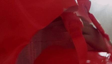 Alla inflates an inflatable swimming vest with her mouth