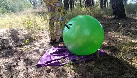 Blowing with feet pump ball in forest