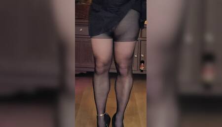 Crossdresser win black tights, heels and dress