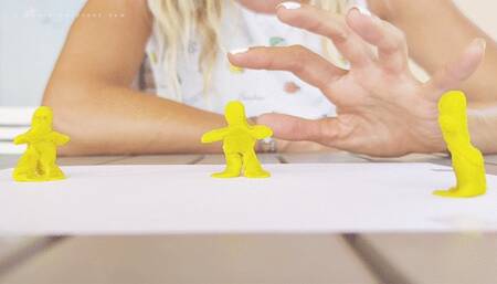 Giantess hand and tiny clay men