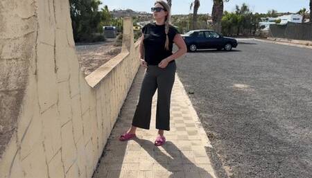 Girl pissing in pants on the street and then showing pussy