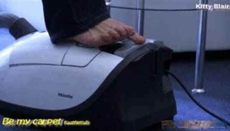 Kitty Blair barefoot in blue jeans vacuuming daily session