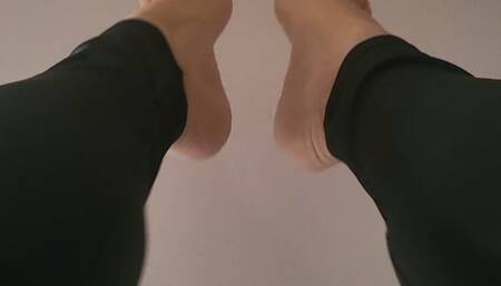 Barefeet posing on the wall