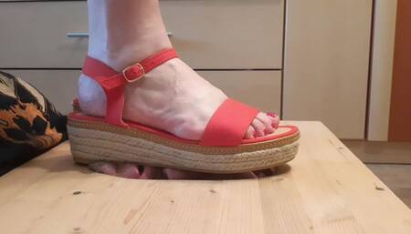 Stomping face in red sandals and barefoot (facebox)