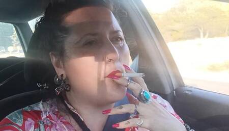 Smoking & driving - jewelry - long pink fingernails (back home)