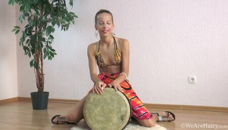 Mimi Lea plays a drum and strips naked on floor