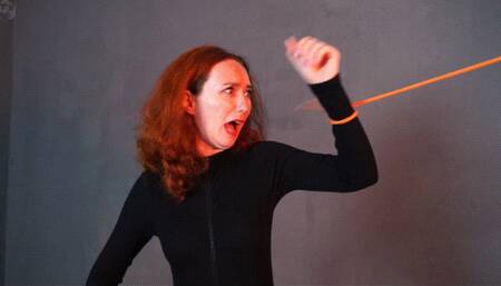 Special agent in vacuum sheath and bondage with orange rope with vibration