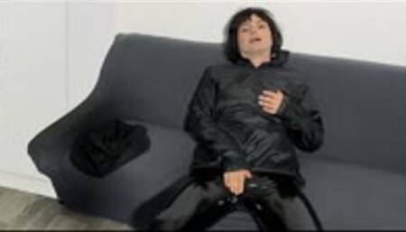 Mireille in her black shiny nylon rain jacket clothes has an orgasm