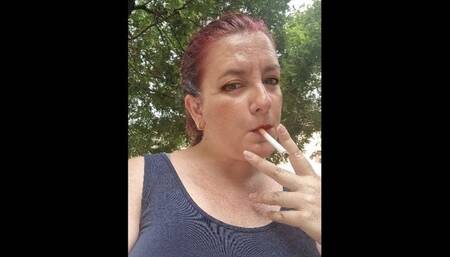 Smoking a Marlboro in a public park 720HD