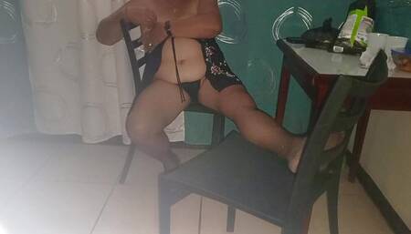 Grandma in lingerie squirts On the chair she caresses her pussy and models her delicious ass
