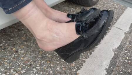 Dangling in my patent black flat shoes outside the car on way to a meeting