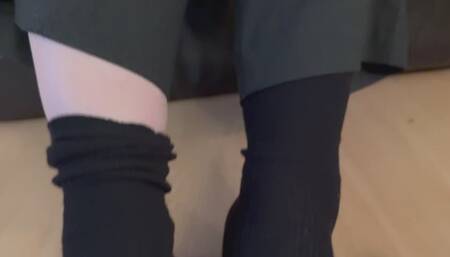 Shoeplay in black flat shoes and black socks