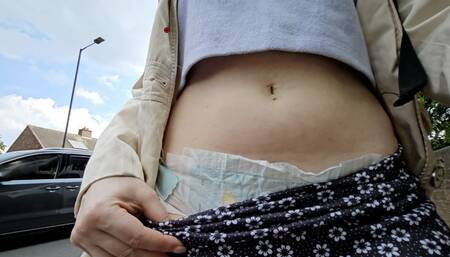 Wet Pampers diaper flashing walking outdoors