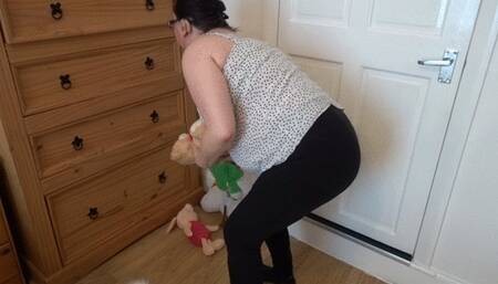 wife undressing in the bedroom in leggings