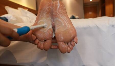 Chinese girl is wrapped like a mummy and tickled on the soles of her feet