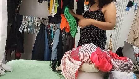 Housewife While She Cleans the Room and Folds and Hangs the Clothes