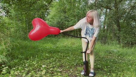 Alla destroys three balloons with a hand pump