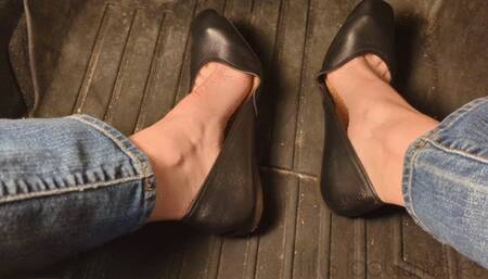 Fifi pedal pumping in sedan wearing black ballet flats and blue jeans replay