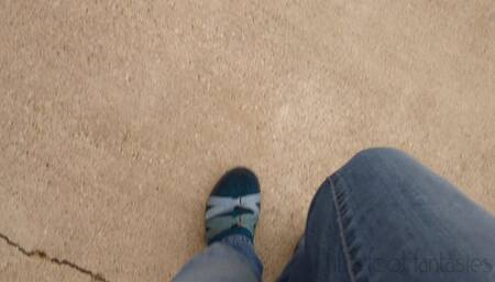 Fifi pedal pumping in Teva hiking sandals with socks and blue jeans replay