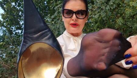 Foot slave training in the park - worn shoes, sweaty stockinged feet