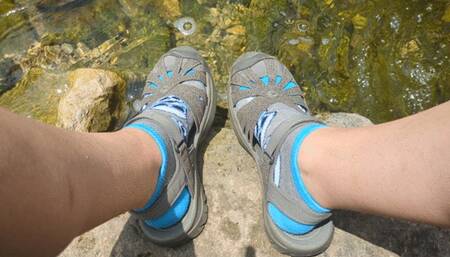 Fifi playing in the creek after yoga fully dressed in capri leggings and socks with sandals replay