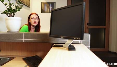 Fucking a redhead behind her working desk