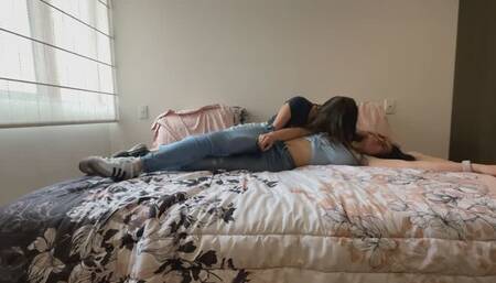 Two lesbians rubbing and slapping their asses