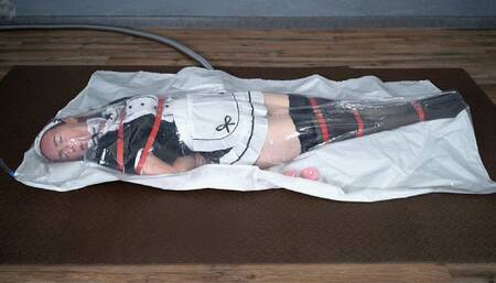 Bondage with red maid straps with vibro in vacuum bag