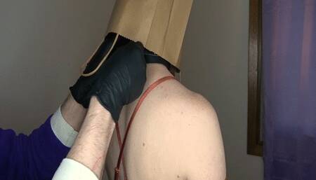 Being Spanked and Standing in the Corner with a Paper Bag over a Woman's Head
