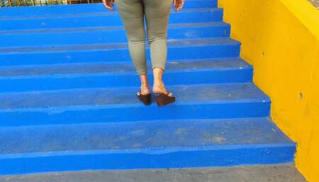 Diana Senior walking on flip flops in the Stadium