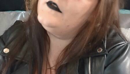 Bad girl smoking in leather