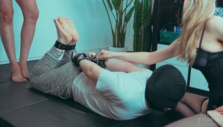 Bullied by Imilia and FeetofJason's feet while hogtied!