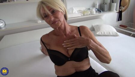 German mature lady playing in bed