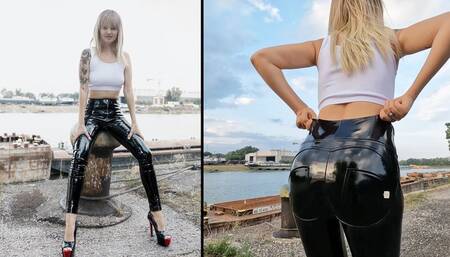 Anastasia walking outdoors in her creaky pvc leggings