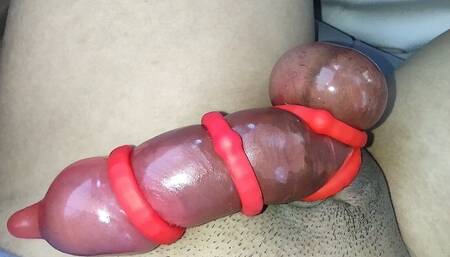 Asian jacking off his red rocket! His cock engorged using cock rings and a condom.
