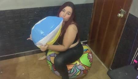 I inflate a 51cm beach ball until it explodes sitting on a 71cm one