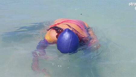 Swimcap and head dunking in the sea