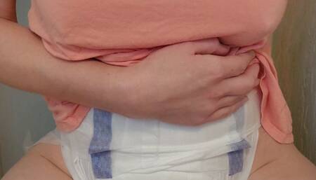 Pinkie pees her diaper on the toilet