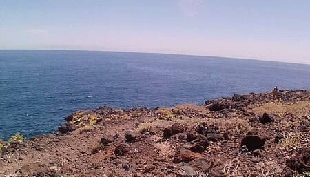 Couple is hiking naked near the coast and highway