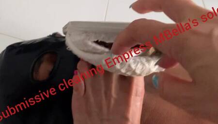 Submissive licking feet and shoes of mature Mistress