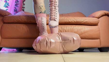 Popping foil balloon with heels