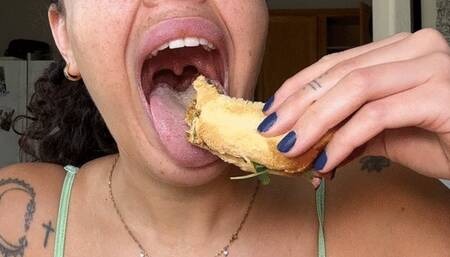 Sammie eat a messy sandwich