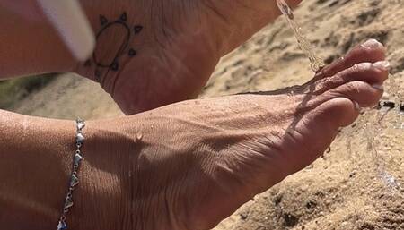 Pretty feet in the sand