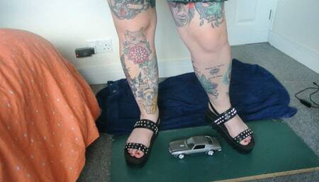 Giantess Jayne crushes a Pontiac Firebird in chunky sandals toy car crush left view