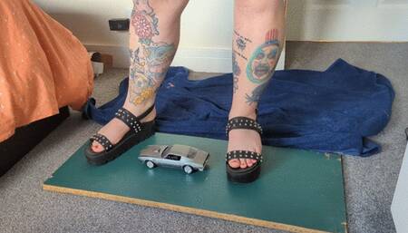 Giantess Jayne crushes a Pontiac Firebird in chunky sandals toy car crush low right view