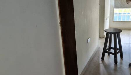 Katherine crossing her sexy legs on flat shoes in front of the mirror