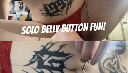 goth girl fingers her belly button and plays with navel piercing