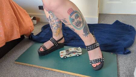 Giantess Jayne crushes an Audi Rally car in chunky sandals toy car crush right side view