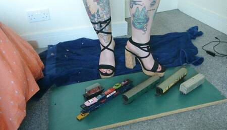 Giantess Jayne crushes some train coaches and small cars in chunky heels toy car crush left view