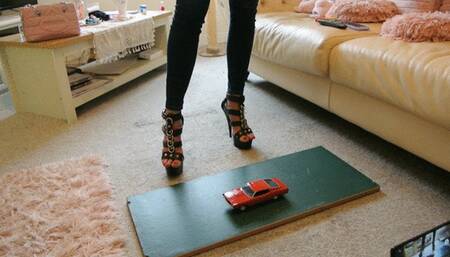 GIANTESS Charn crushes a 1969 Ford Torino in black stiletto high heels left side view
